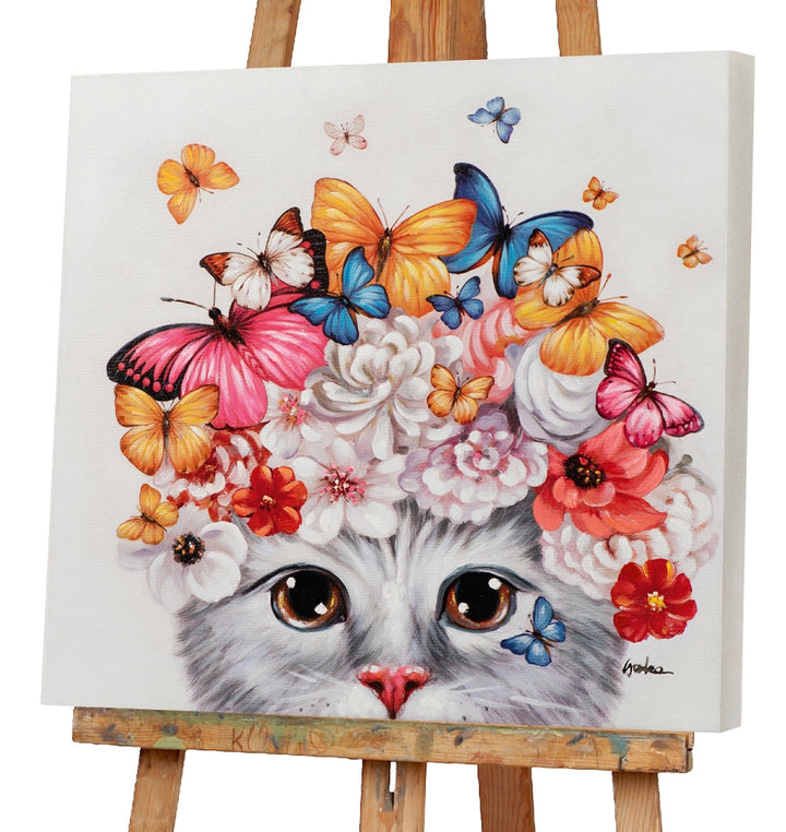 Kätzchen mit Blumen und Schmetterlingen