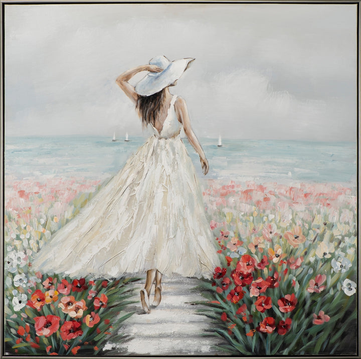 Frau in Blumenmeer im weißen Kleid